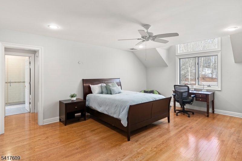 2 Cobblefield Road Mendham, NJ 07945 - Photo 31 of 50 a spacious bedroom with a bed and a table