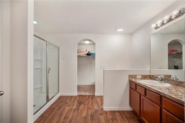 a view of bathroom with a sink and mirror