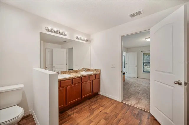 a bathroom with a glass shower door
