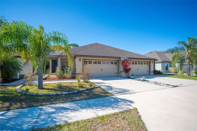 a front view of house with yard space and swimming pool