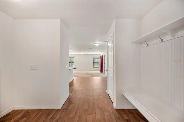 a bathroom with a granite countertop sink a toilet and bathtub