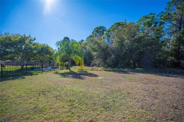 a front view of a house with swimming pool having outdoor seating