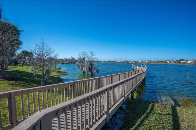 a view of a swimming pool with an outdoor seating