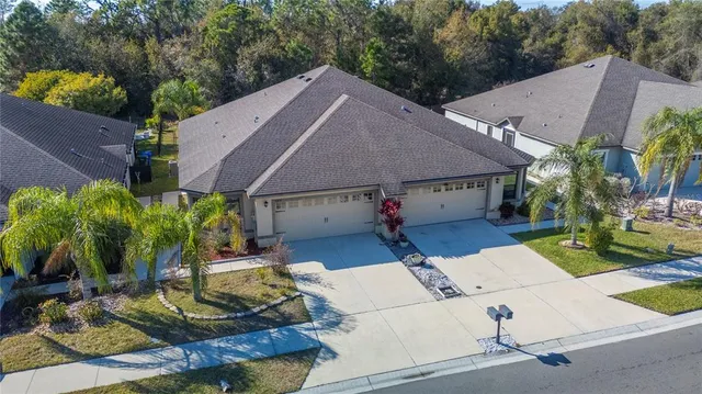 an aerial view of a house with a ocean view