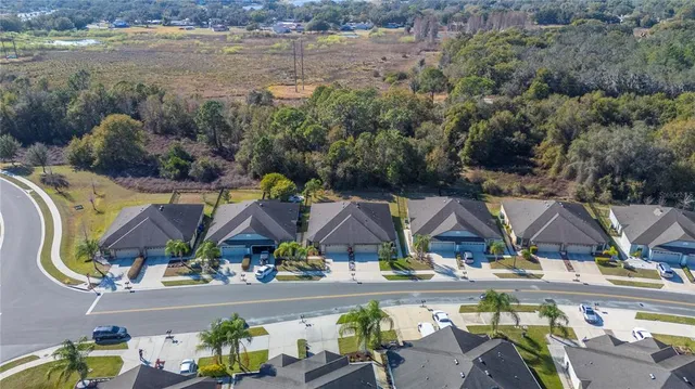 an aerial view of a house with a lake view