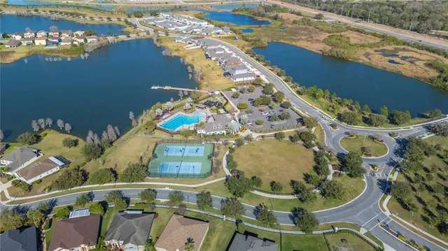 an aerial view of a house swimming pool patio and outdoor seating