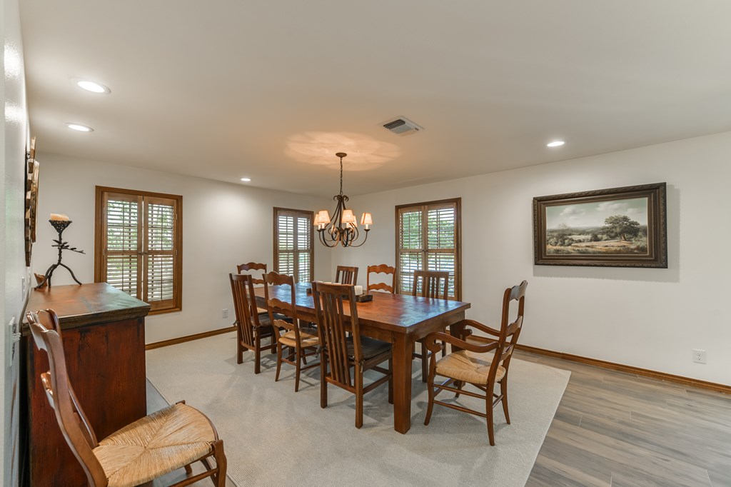 0 County Road Evant, TX 76525 - Photo 34 of 41 a view of a dining room with furniture window and wooden floor