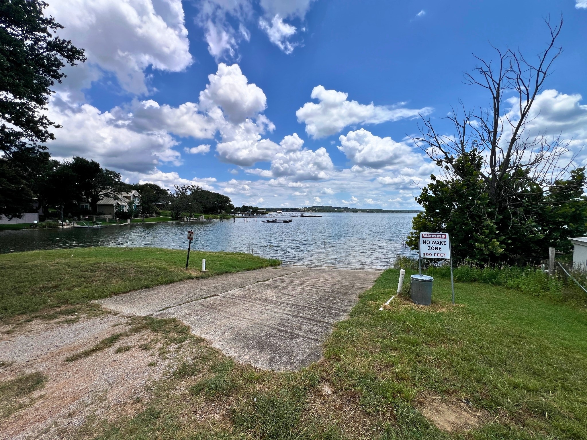 706 Cr138a Road Burnet, TX 78611 - Photo 18 of 18 A tranquil waterfront setting with a private boat launch leading into calm waters, perfect for leisure.