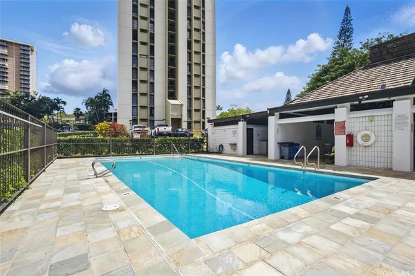 a view of a swimming pool with a lounge chairs