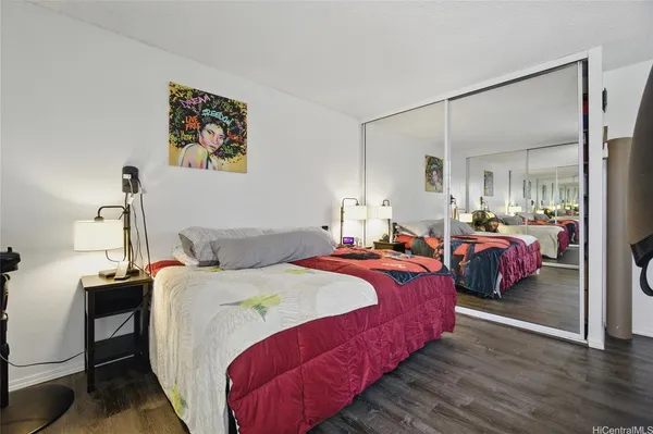 a bed room with a bed and a painting