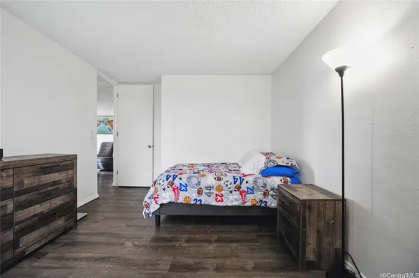 a bed room with a bed and a baby crib