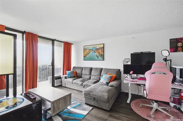 a living room with furniture and large window