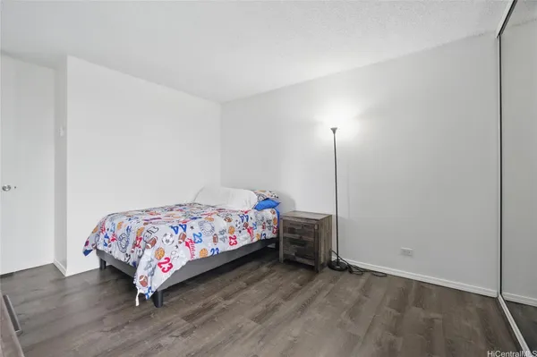 a bedroom with a bed and a closet