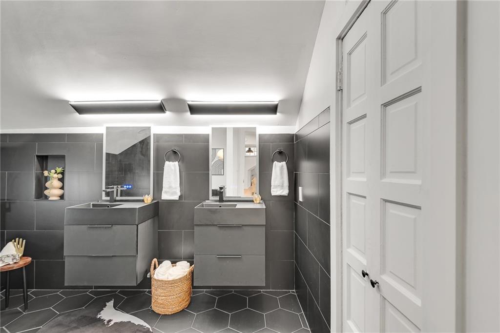 901 Argonne Avenue Northeast, Unit B Atlanta, GA 30309 - Photo 20 of 30 a bathroom with a sink and a large mirror