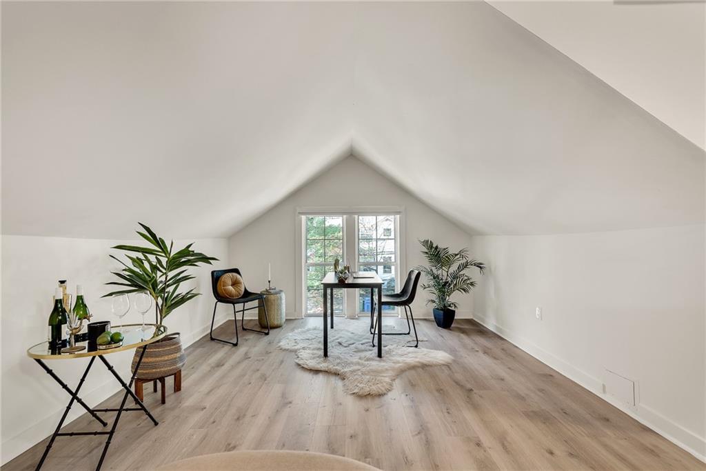 901 Argonne Avenue Northeast, Unit B Atlanta, GA 30309 - Photo 2 of 30 a living room with furniture a window and potted plants