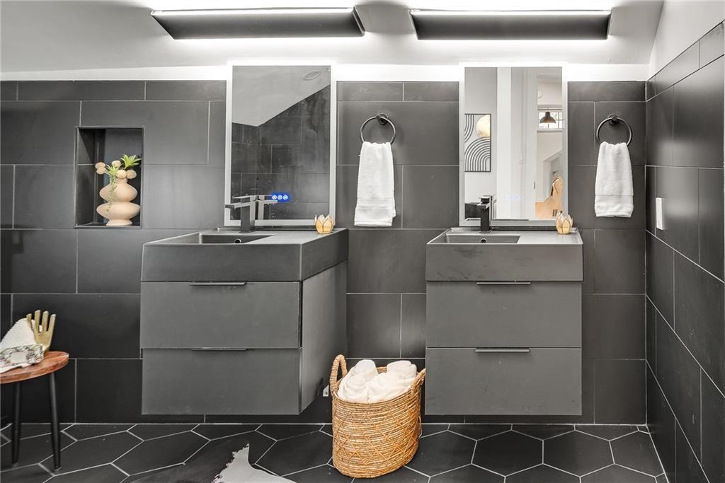901 Argonne Avenue Northeast, Unit B Atlanta, GA 30309 - Photo 21 of 30 a bathroom with a sink and a mirror