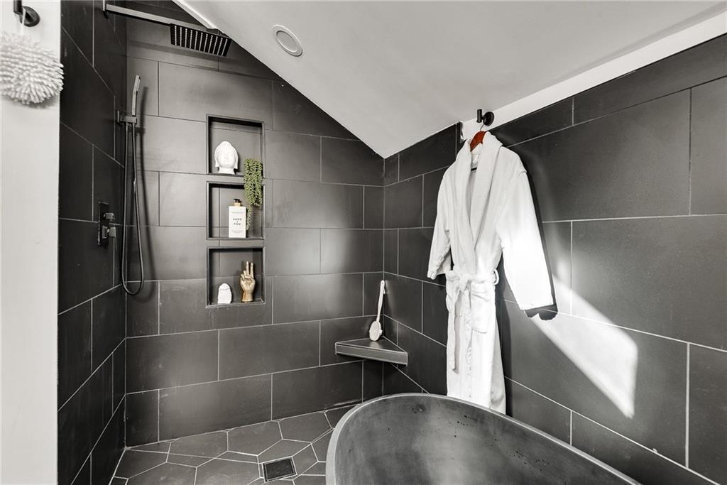 901 Argonne Avenue Northeast, Unit B Atlanta, GA 30309 - Photo 24 of 30 a view of walk in closet with clothes and shoes