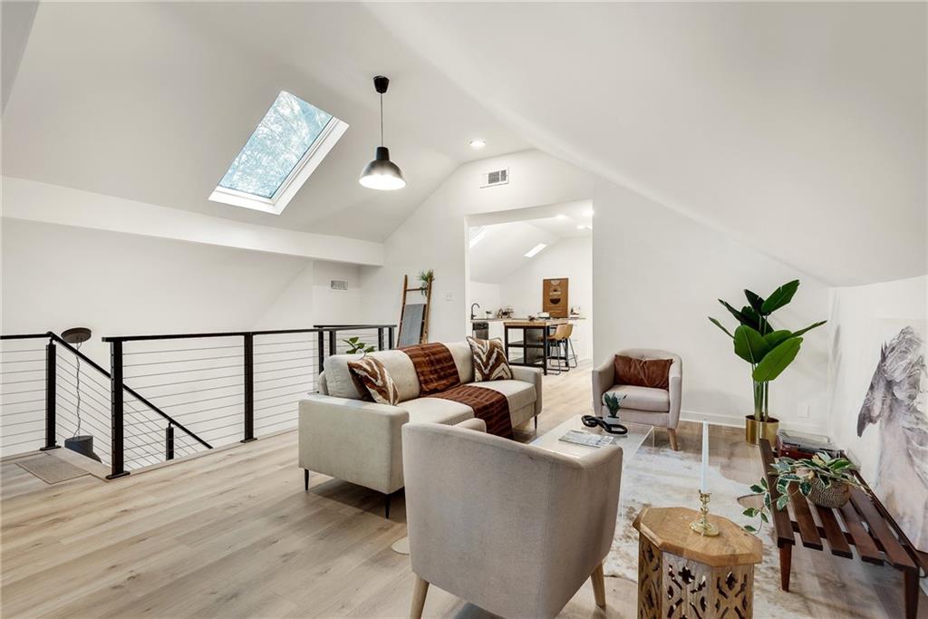 901 Argonne Avenue Northeast, Unit B Atlanta, GA 30309 - Photo 3 of 30 a living room with furniture and wooden floor