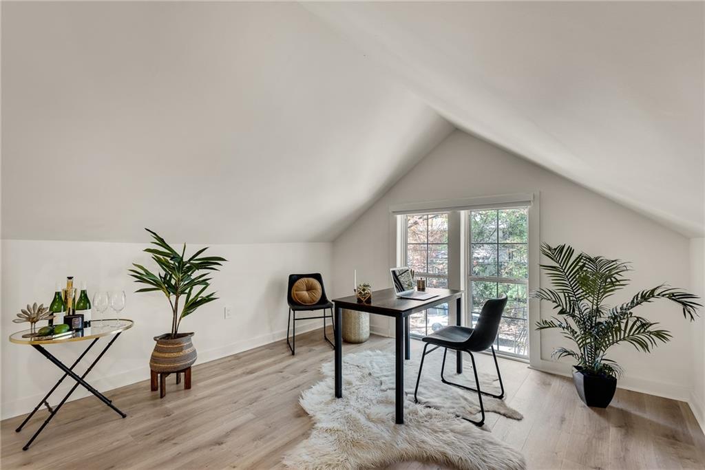 901 Argonne Avenue Northeast, Unit B Atlanta, GA 30309 - Photo 7 of 30 a living room with furniture and a potted plant