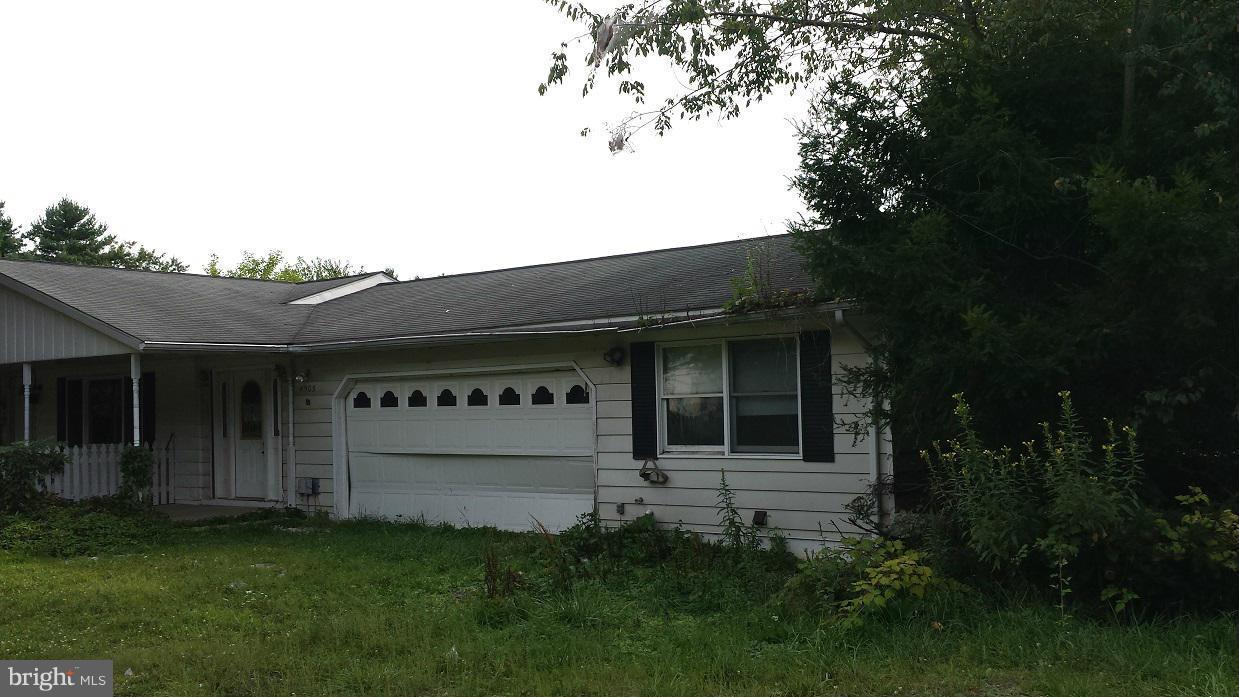 4903 Millers Station Road Hampstead, MD 21074 - Photo 1 of 10 a black house with outdoor space