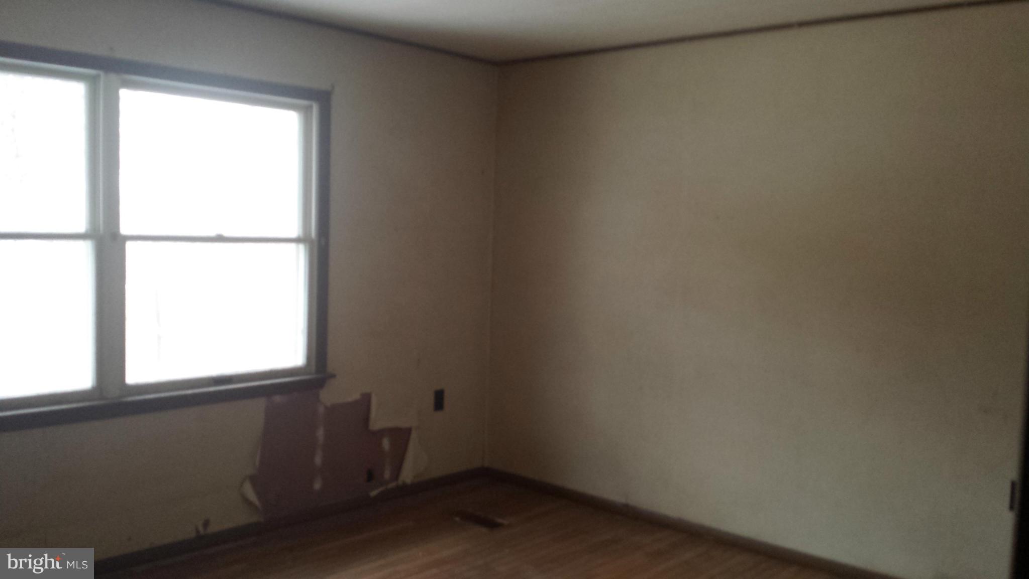 4903 Millers Station Road Hampstead, MD 21074 - Photo 4 of 10 an empty room with a window