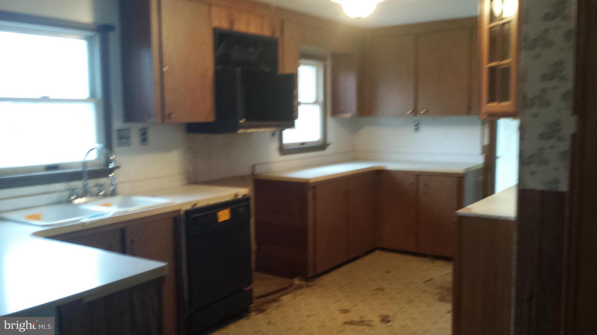 4903 Millers Station Road Hampstead, MD 21074 - Photo 10 of 10 a kitchen with stainless steel appliances granite countertop a sink stove and cabinets