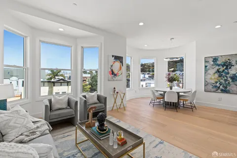 a front view of a residential apartment building with a yard