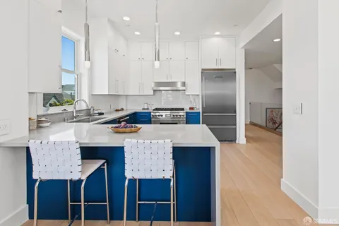a bathroom with a double vanity sink mirror double and shower