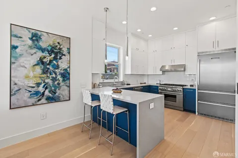 a bathroom with a sink a mirror and a shower