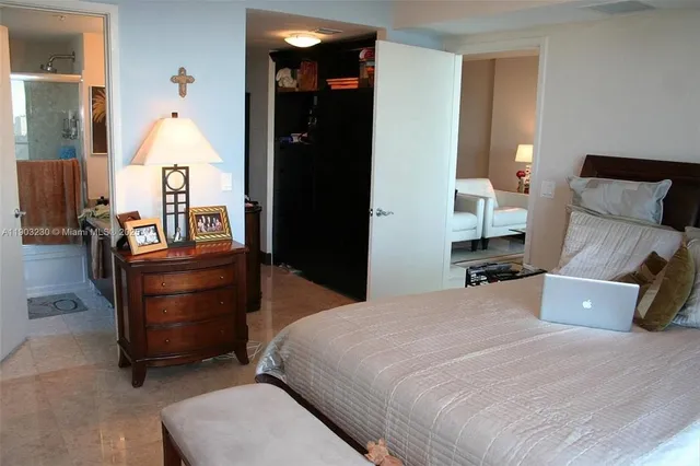 a bed room with a bed and a television