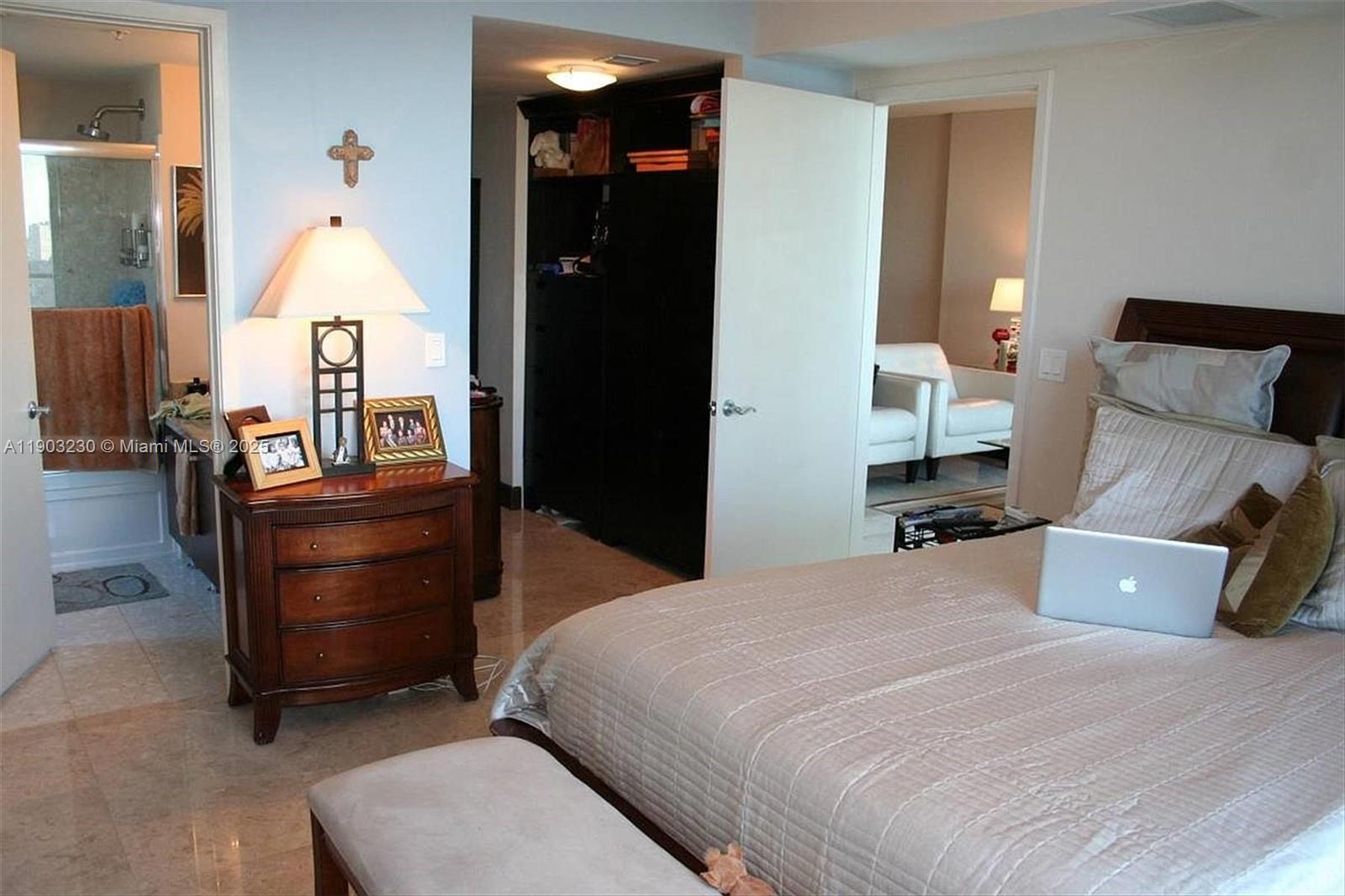 185 Southwest 7th Street, Unit 1802 Miami, FL 33130 - Photo 15 of 39 a bed room with a bed and a dresser