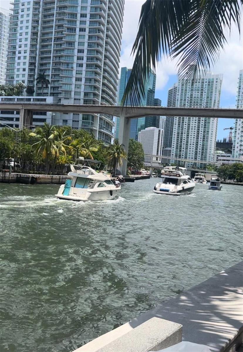 185 Southwest 7th Street, Unit 1802 Miami, FL 33130 - Photo 2 of 39 a view of swimming pool with outdoor seating and plants