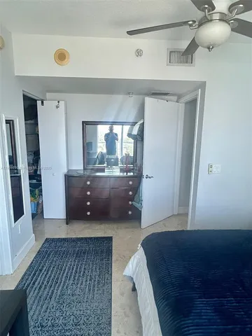 a living room with furniture and a toilet