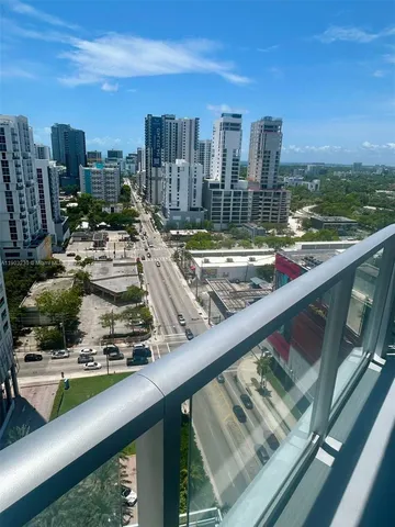 a living room with a bed and furniture