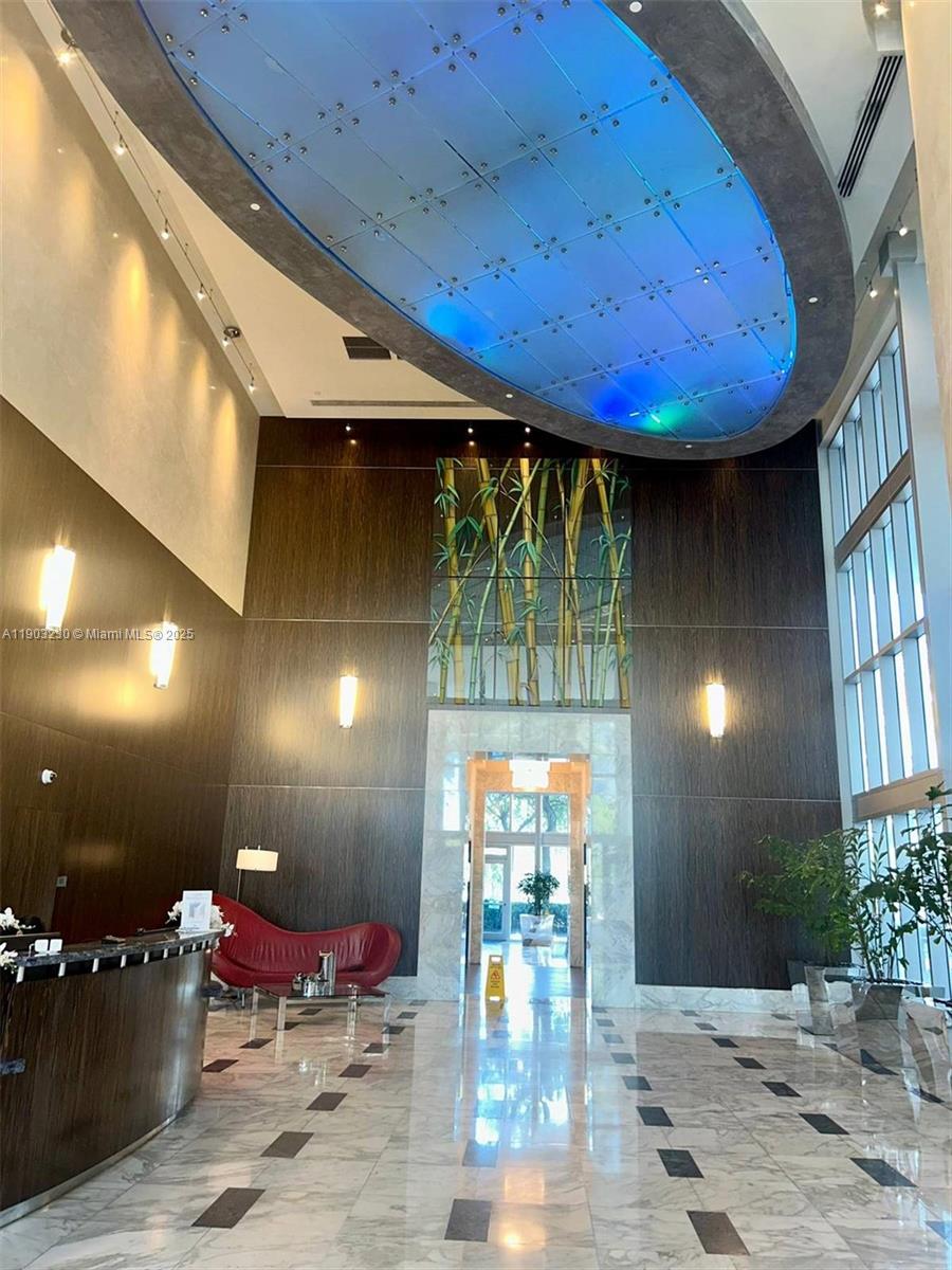 185 Southwest 7th Street, Unit 1802 Miami, FL 33130 - Photo 35 of 39 a room with furniture and tables