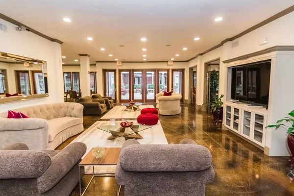 a living room with furniture and a large window