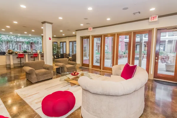 a view of play room with windows and tables