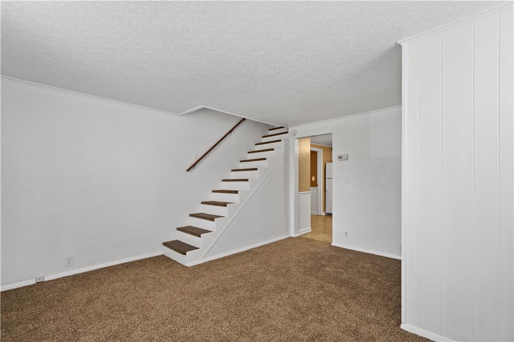 401 Upper Road Pittsburgh, PA 15228 - Photo 14 of 32 a view of an empty room with stairs