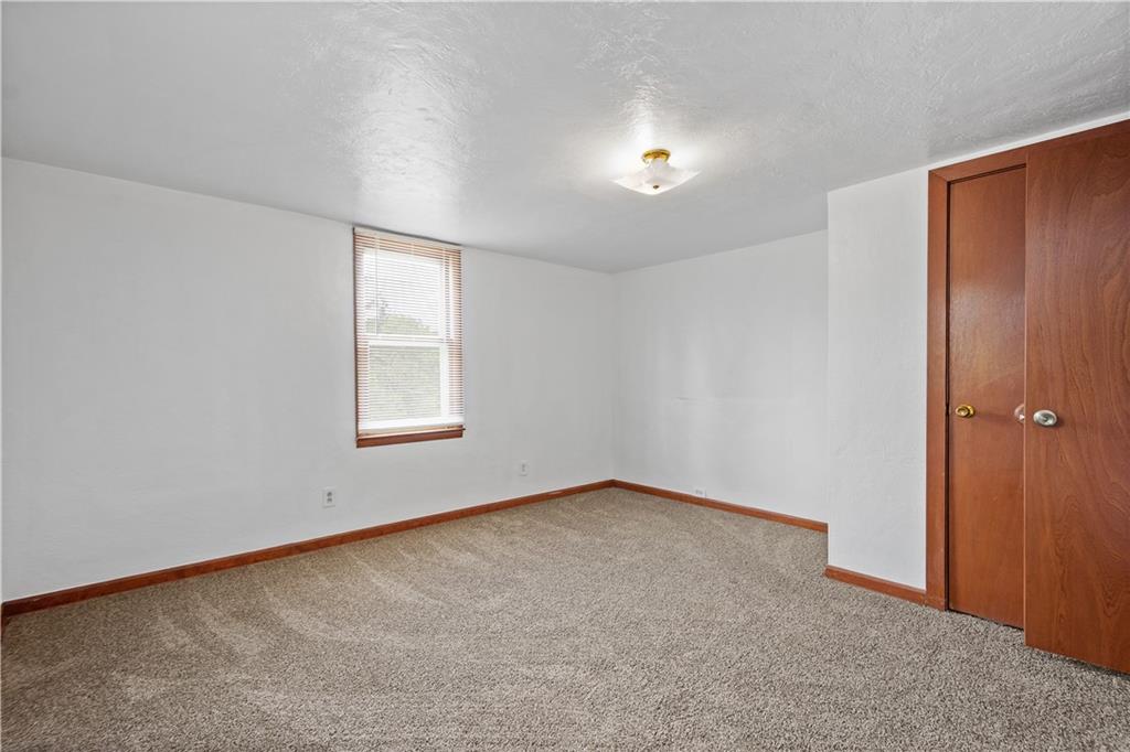 401 Upper Road Pittsburgh, PA 15228 - Photo 18 of 32 an empty room with windows and closet