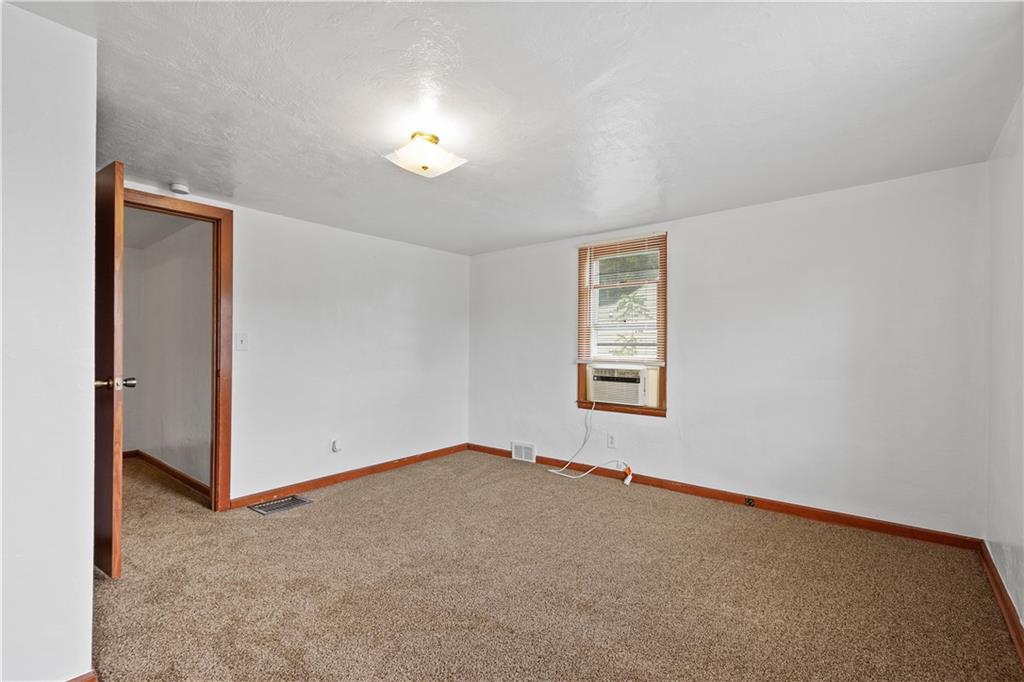 401 Upper Road Pittsburgh, PA 15228 - Photo 19 of 32 an empty room with windows and chandelier fan