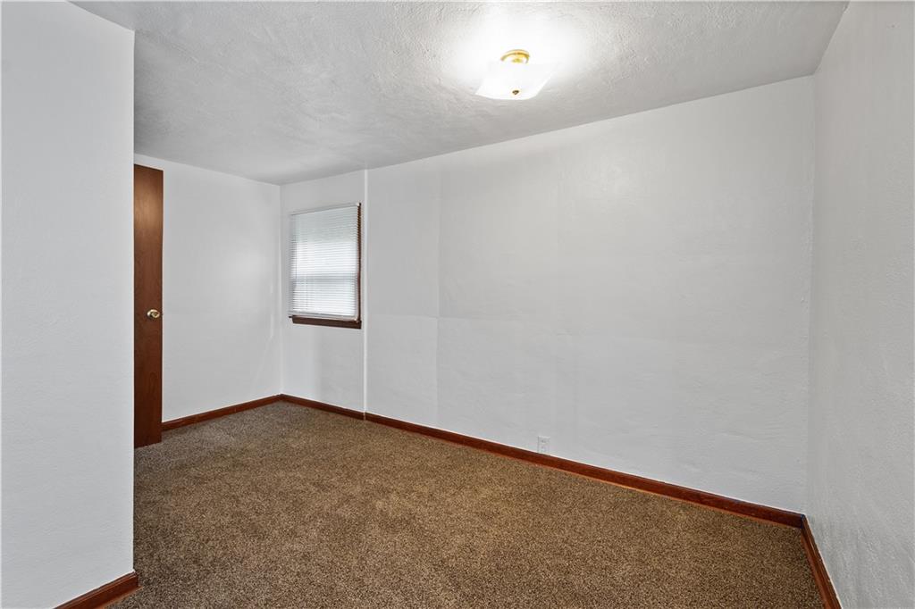 401 Upper Road Pittsburgh, PA 15228 - Photo 22 of 32 an empty room with windows