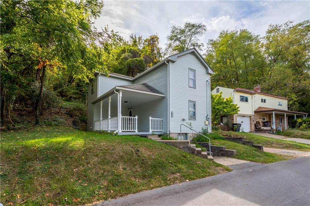 401 Upper Road Pittsburgh, PA 15228 - Photo 6 of 32 a front view of a house with a yard