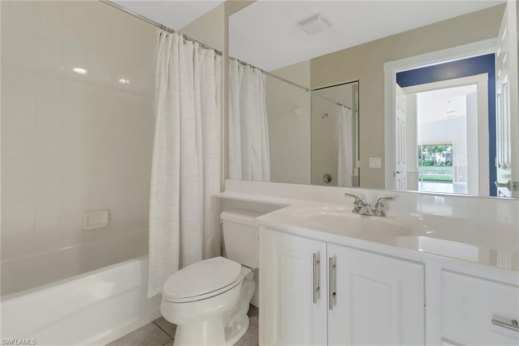 7933 Umberto Court Naples, FL 34114 - Photo 14 of 17 a bathroom with a sink toilet and shower
