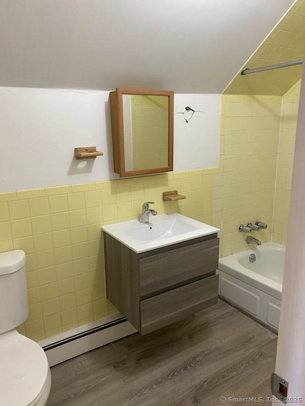 17 Pearl Street New Haven, CT 06511 - Photo 3 of 7 a bathroom with a sink mirror vanity and toilet