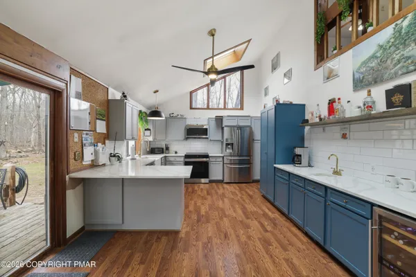 a kitchen with sink cabinets and window