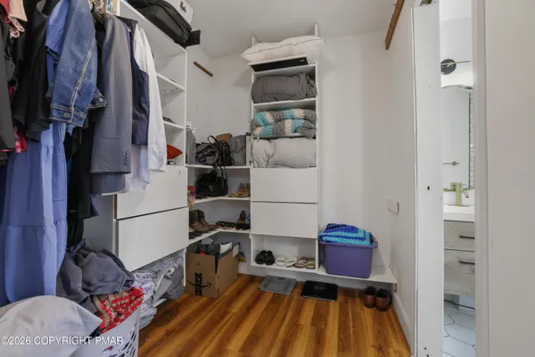 a bathroom with a sink a toilet and shower curtain