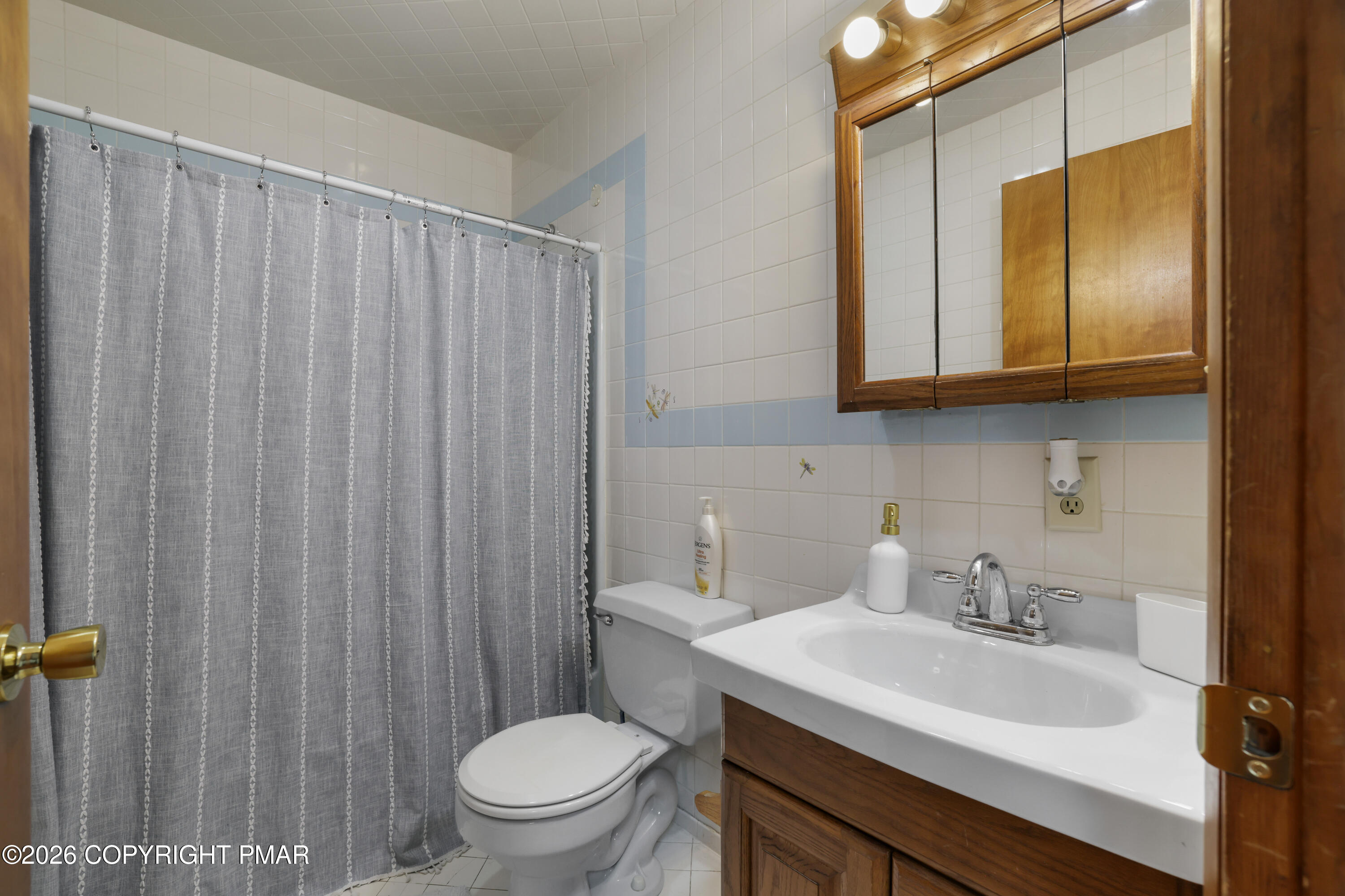 3638 Bristol Circle West East Stroudsburg, PA 18302 - Photo 31 of 62 a bathroom with a sink a toilet and shower curtain