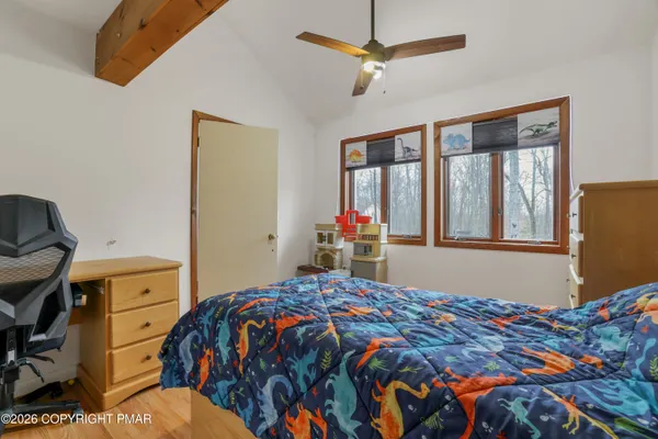 a bedroom with a bed and furniture