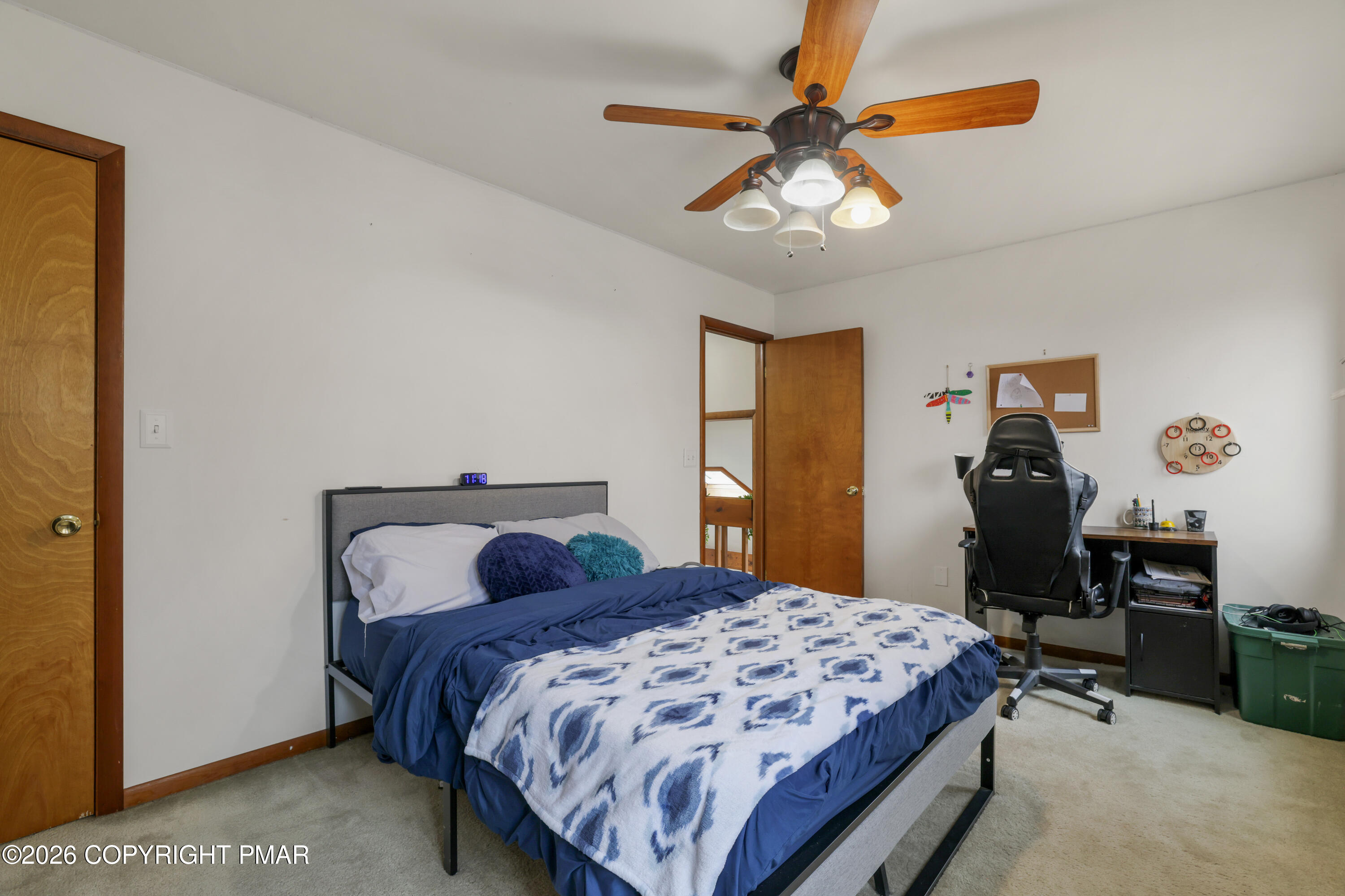3638 Bristol Circle West East Stroudsburg, PA 18302 - Photo 37 of 62 a bedroom with a bed and a chandelier