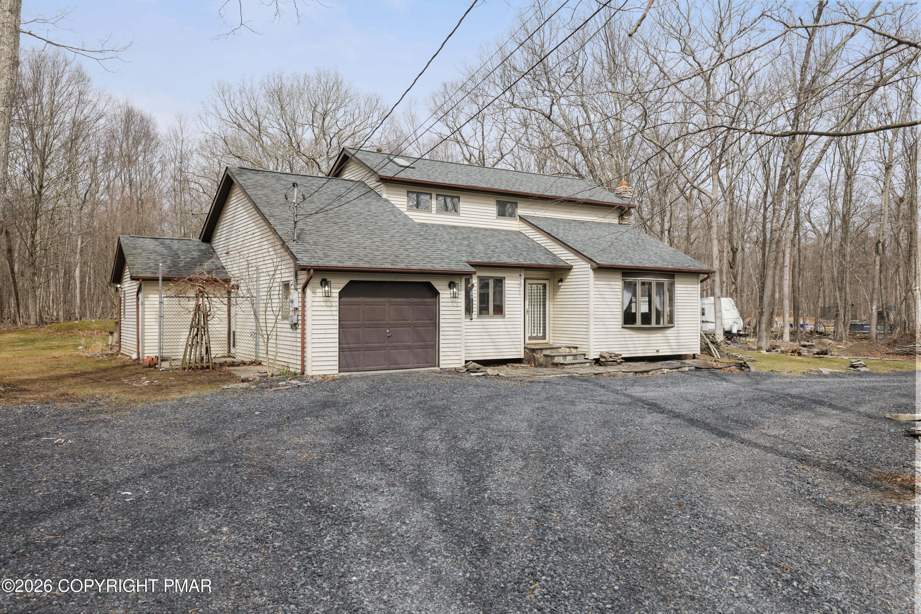 3638 Bristol Circle West East Stroudsburg, PA 18302 - Photo 62 of 62 a front view of a house with a garden and trees
